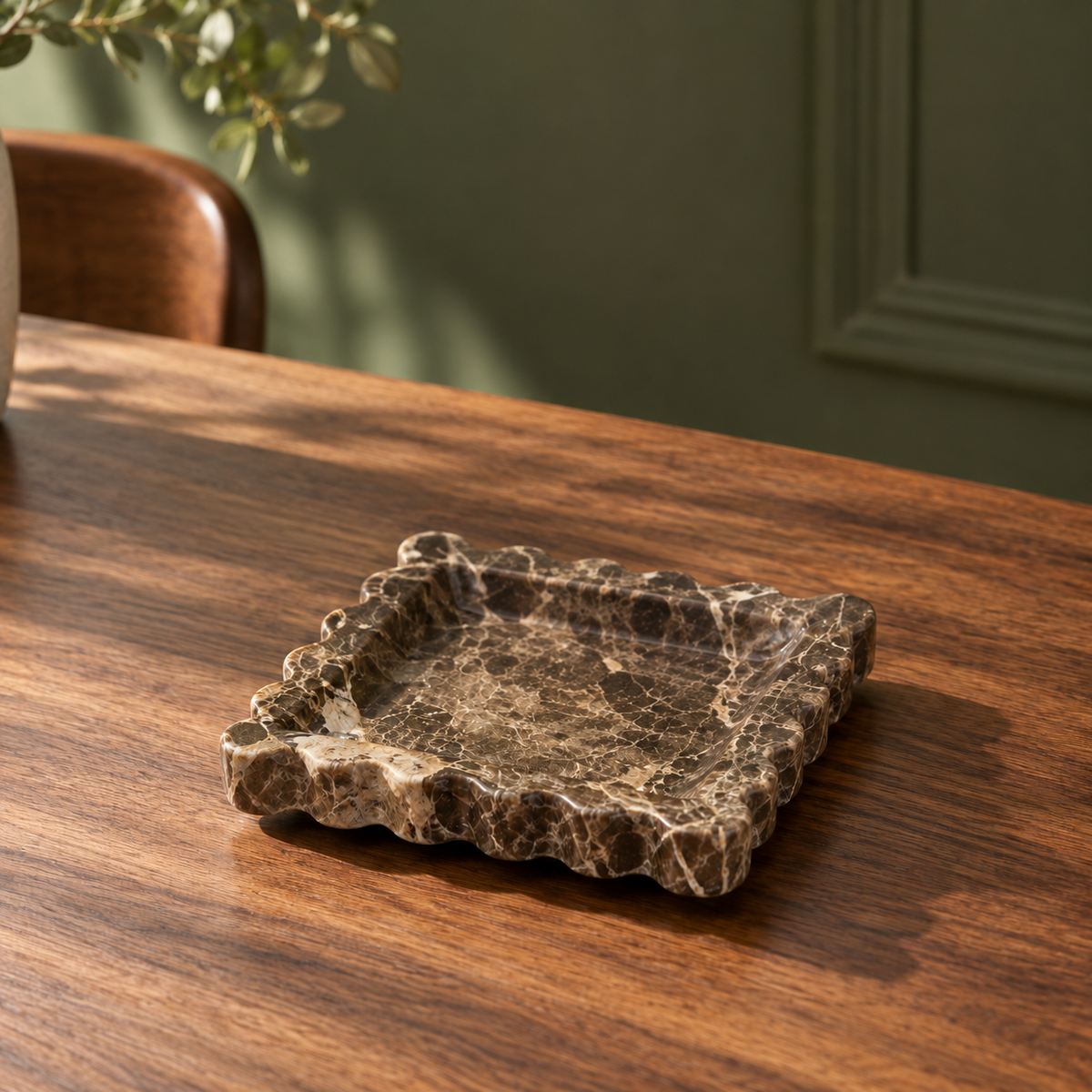 Scalloped Marble Dish on a dining table in warm natural light