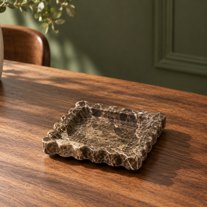 Scalloped Marble Dish on a dining table in warm natural light