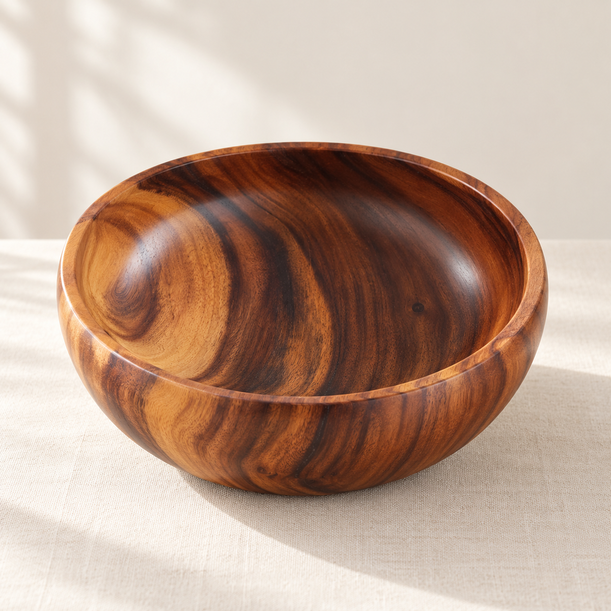 Acacia Wood Bowl on a cream stone surface in soft daylight