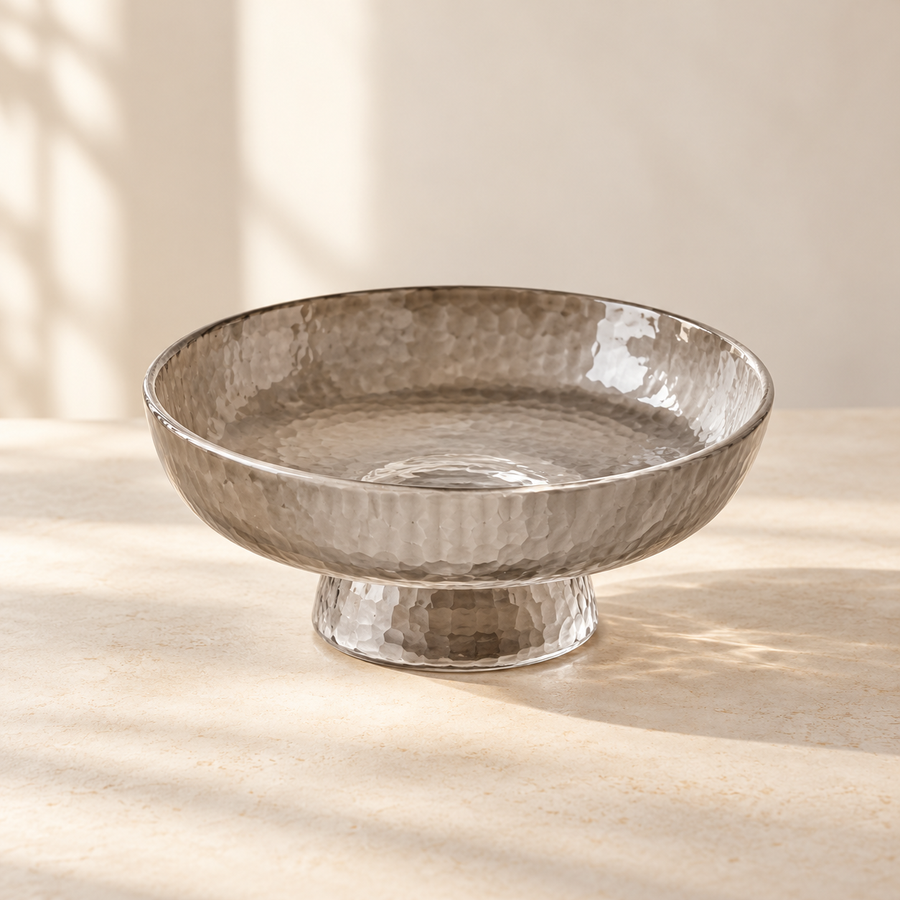 Ribbed Glass Pedestal Bowl on a cream stone surface in soft daylight